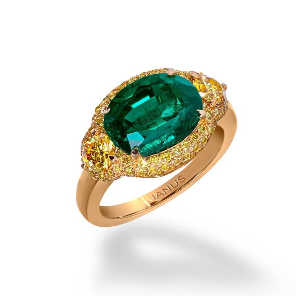 Haute joaillerie collection 3.719 carat, old mine Colombian emerald ring, accented by two brilliant cut, fancy vivid yellow diamonds