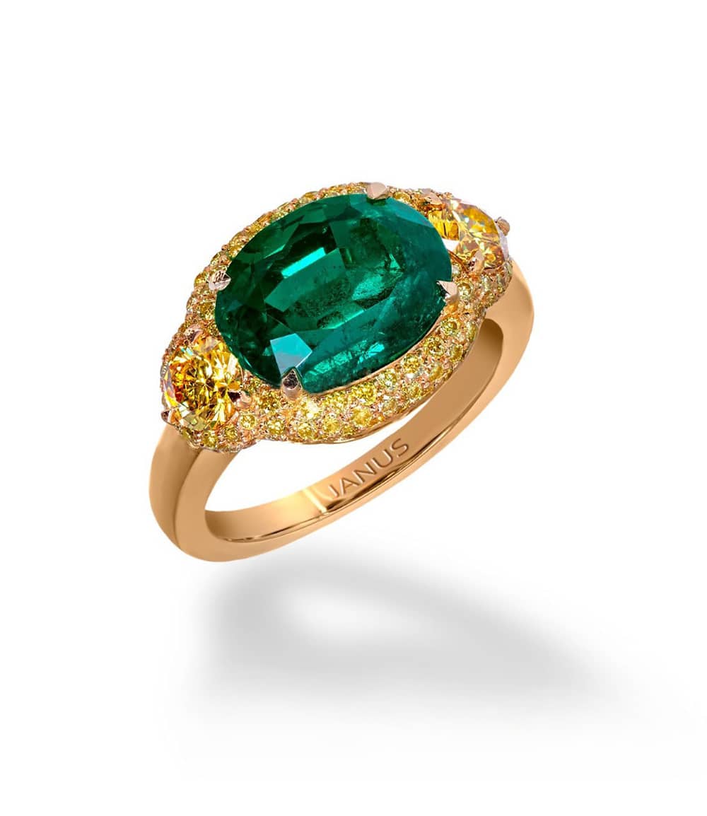 3.719 carat, old mine Colombian emerald ring, accented by two brilliant cut, fancy vivid yellow diamonds